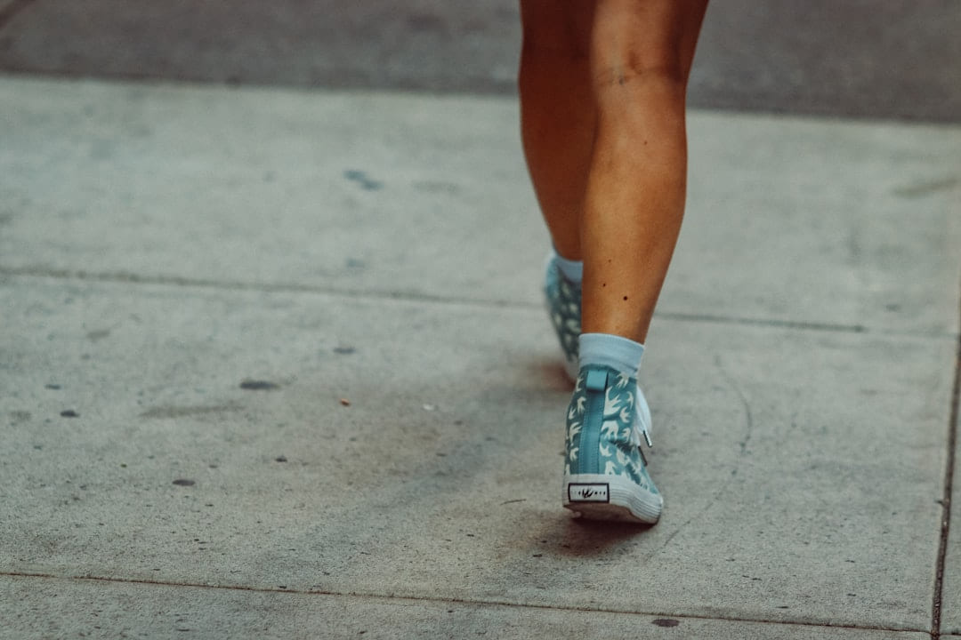 Legs and feet walking on a sidewalk on Think Lean Live Strong