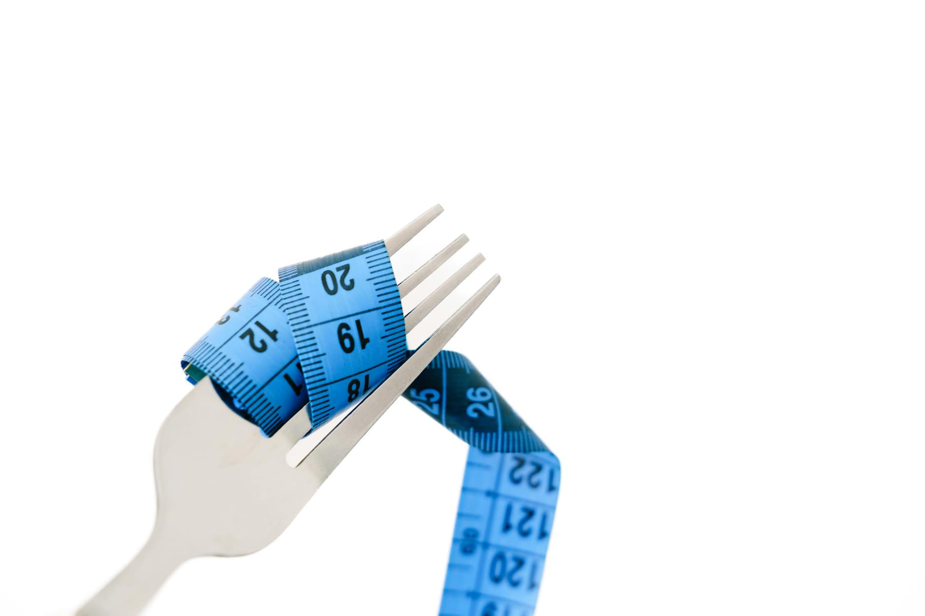 A fork wrapped with a blue measuring tape symbolizing diet and weight management. on Think Lean Live Strong