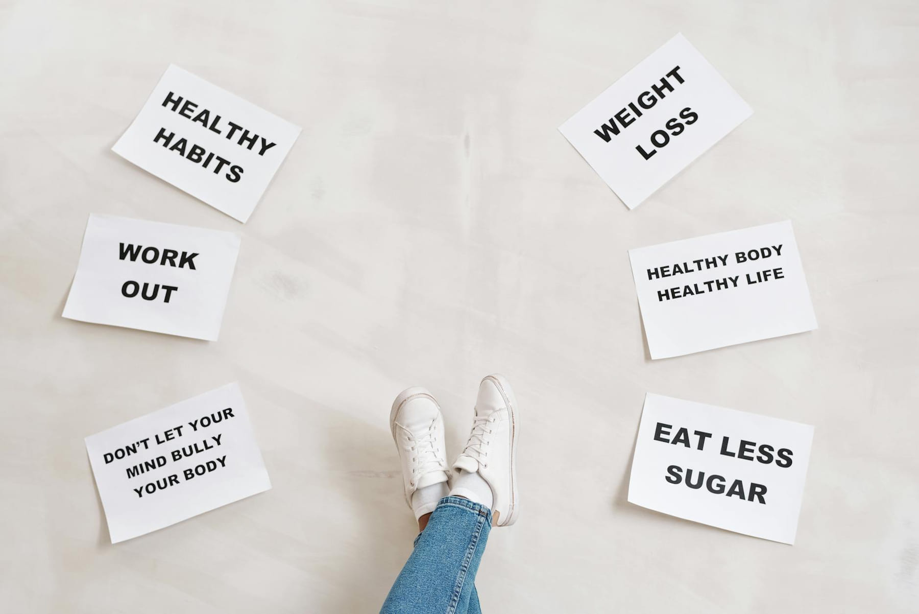 Inspirational health and fitness messages with shoe-clad feet, promoting healthy habits and wellbeing. on Think Lean Live Strong