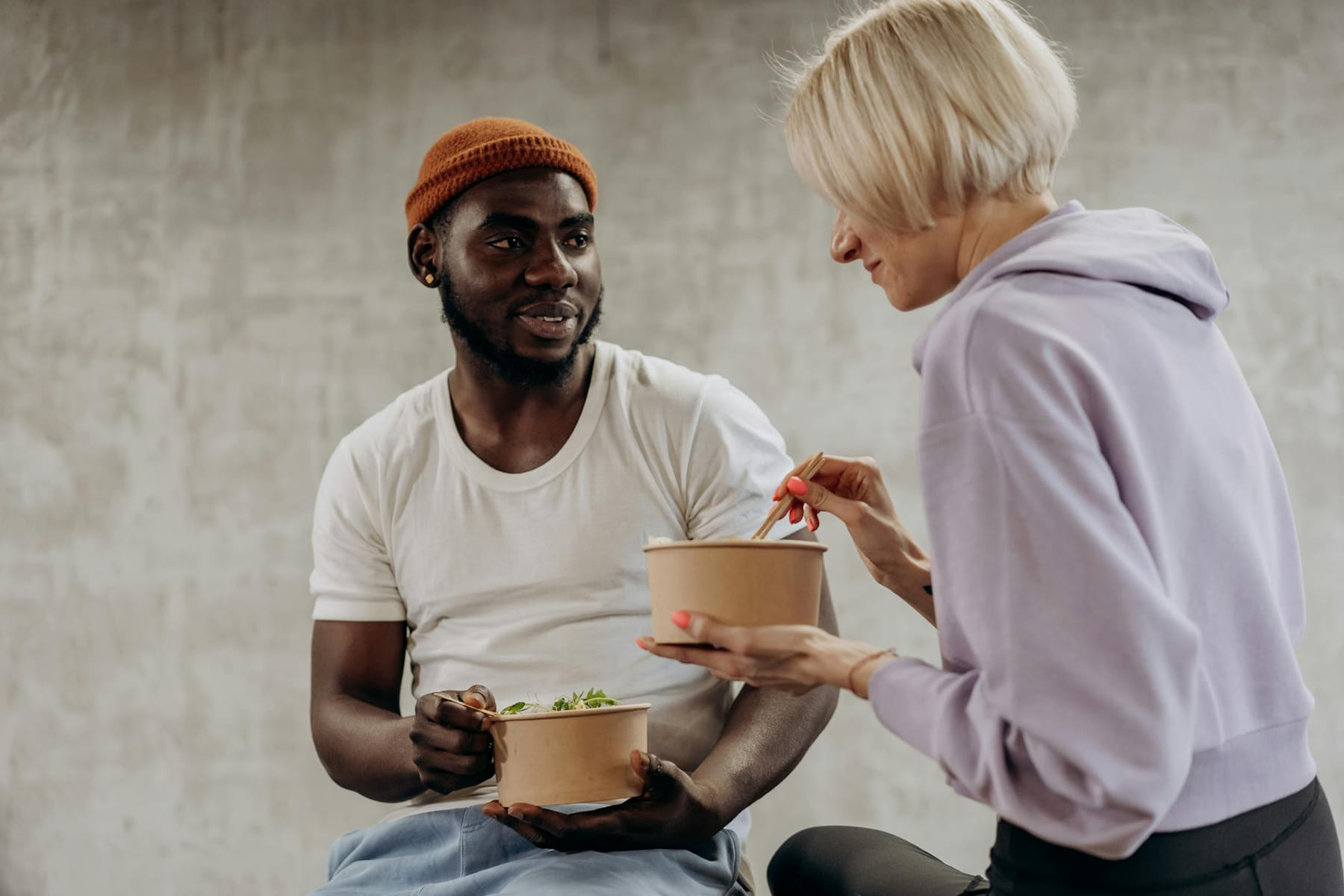 Two friends enjoying a healthy meal together, promoting nutrition and well-being. on Think Lean Live Strong
