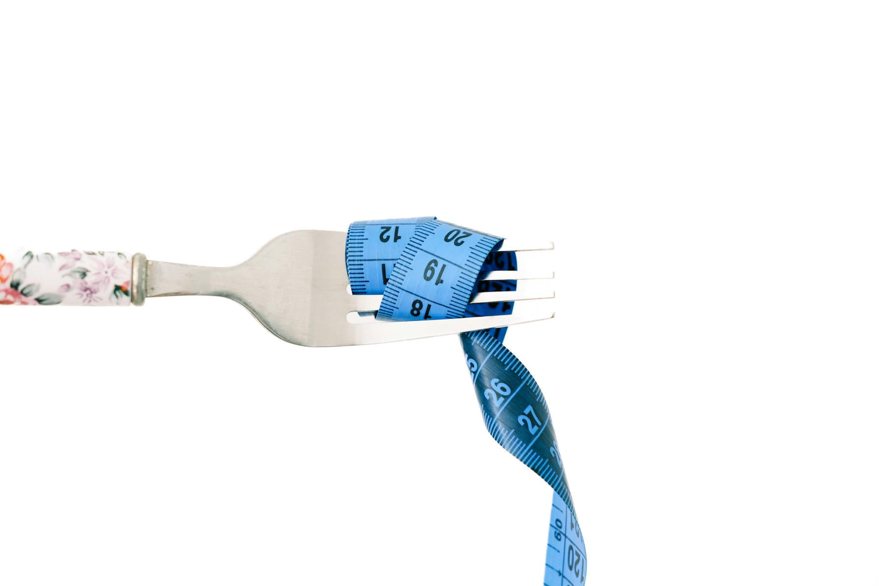 A close-up of a fork wrapped in blue measuring tape, symbolizing diet and weight management. on Think Lean Live Strong