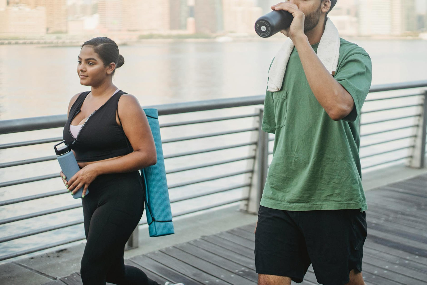 A couple engages in fitness walking by the riverside, embodying a healthy lifestyle. on Think Lean Live Strong